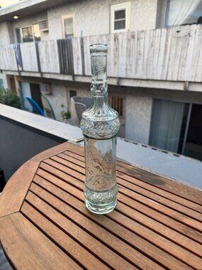 Vintage Clear Glass Decorative Bottle With Ornate Floral Design